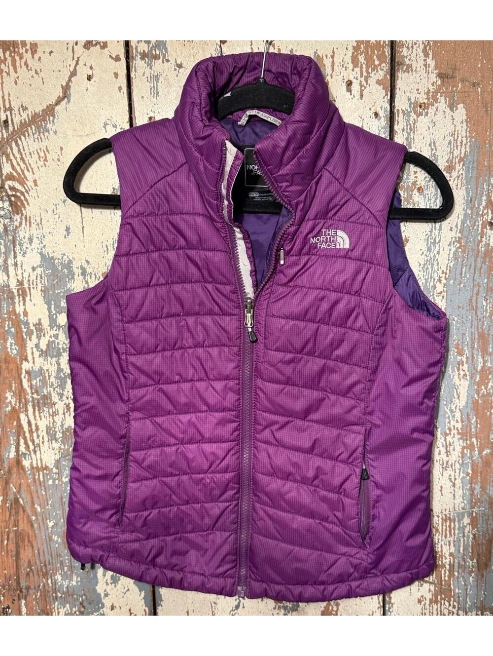 The North Face purple puffer vest, women’s size XS